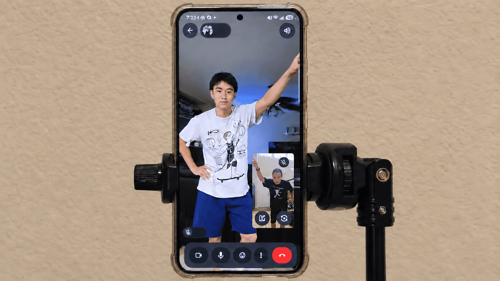 Student practicing during an online dance coaching session, with Ceech visible in the phone’s picture-in-picture view