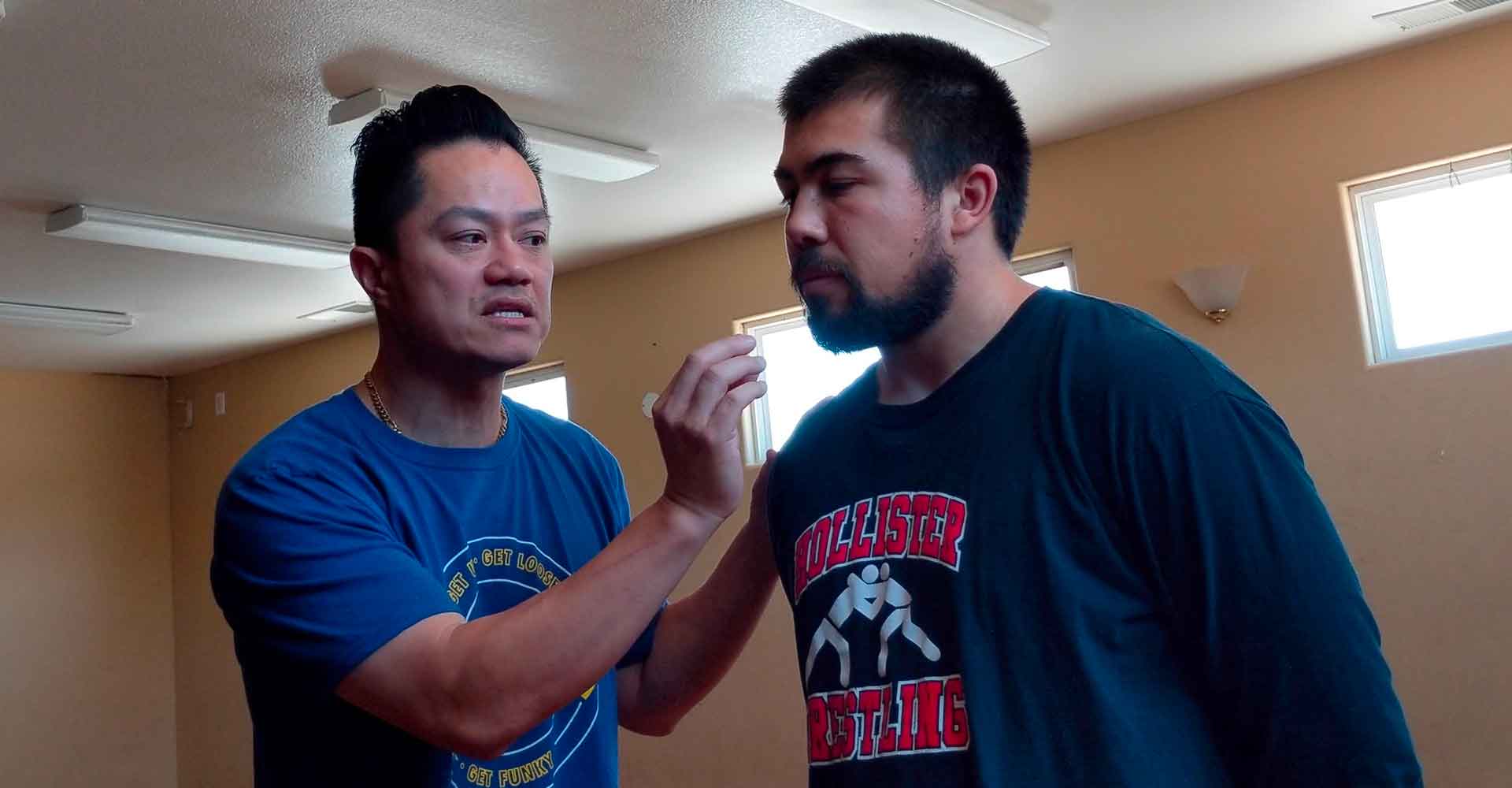 Ceech explaining a neck movement during an in-person private lesson